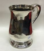 A massive Georgian silver baluster shaped tankard