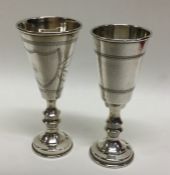 A matched pair of silver goblets engraved with wri