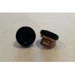 A pair of gilt metal and onyx cufflinks. Approx. 1
