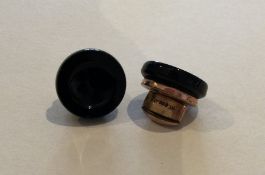 A pair of gilt metal and onyx cufflinks. Approx. 1