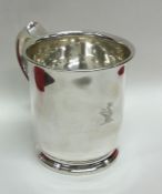 A good quality crested silver mug on spreading bas