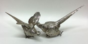 A pair of cast silver pheasants of typical modelle