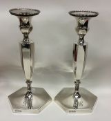 A good pair of large silver candlesticks of hexago