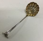 A Georgian silver sifter spoon with gilt bowl. Lon