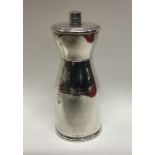 A stylish silver pepper grinder of Art Deco form.