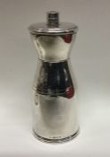 A stylish silver pepper grinder of Art Deco form.