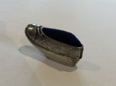 A Chinese silver pin cushion in the form of a shoe