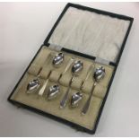 A cased set of six Edwardian silver teaspoons. She