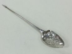 A pierced and engraved Georgian silver mote spoon.