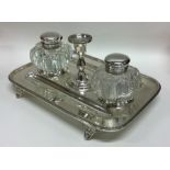 A Victorian silver inkwell with beaded rim to hing