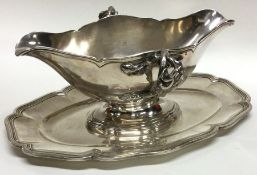 A heavy French silver double lip sauce boat with c