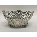 An attractive pierced silver basket with scroll de