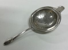 A heavy engine turned silver tea strainer. Sheffie