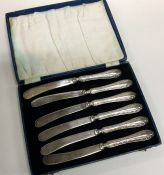 A cased set of six silver handled tea knives. Est.