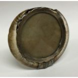 An unusual silver mounted picture frame with tusk