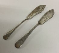 Two Edwardian silver butter knives. Various dates