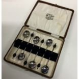 A boxed set of six silver plated bean top coffee s
