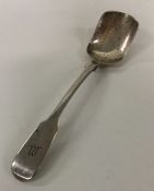 A large Colonial fiddle pattern silver sugar spoon