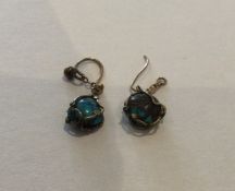 A pair of gold mounted and turquoise earrings. App