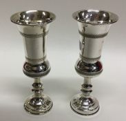 A pair of good silver engraved goblets on pedestal