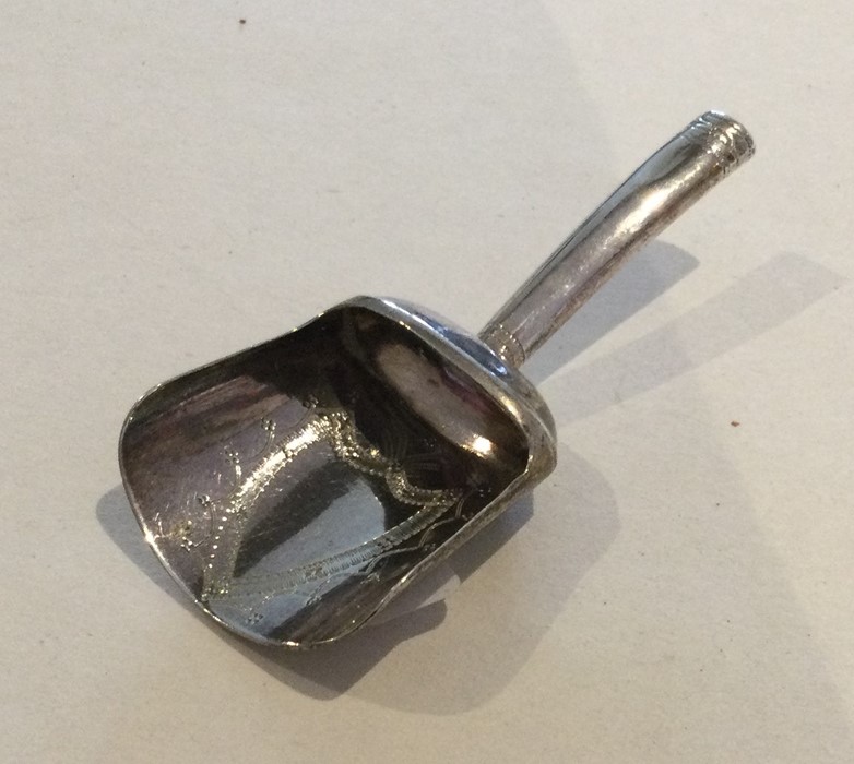 A Georgian silver caddy scoop with bright cut deco