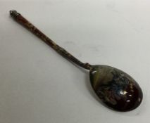 An unusual red enamelled Russian silver spoon. App