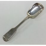 A silver fiddle pattern sugar spoon. London. By SS