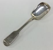 A silver fiddle pattern sugar spoon. London. By SS