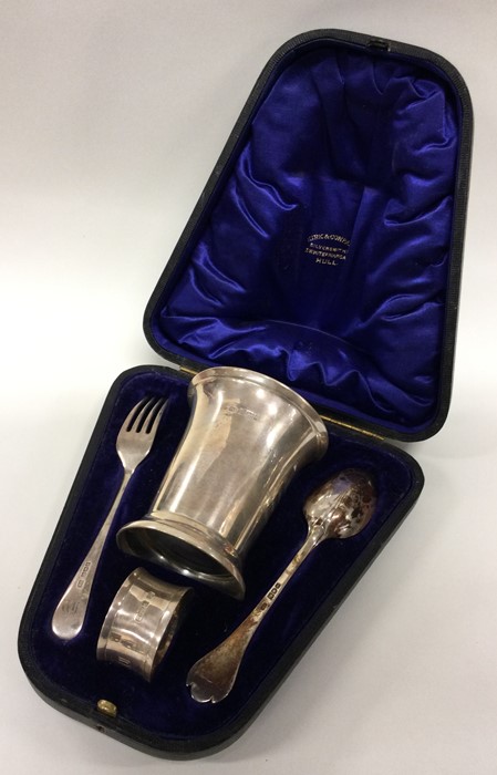 A heavy four piece silver christening set containe