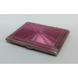 A good silver and pink enamelled cigarette case. B