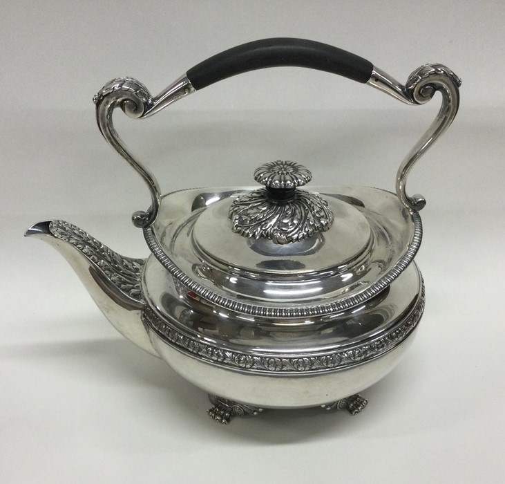 A heavy silver kettle with gadroon rim. London. By