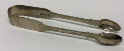 EXETER: A pair of fiddle pattern silver sugar tong