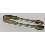 EXETER: A pair of fiddle pattern silver sugar tong