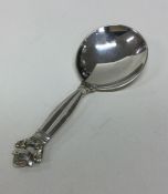 GEORG JENSEN: A silver caddy spoon of typical form