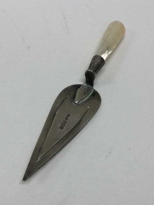 A silver and MOP bookmark with tapering handle. Ap