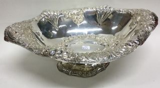 A large Victorian chased silver fruit basket profu