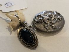 A Continental silver locket together with a brooch