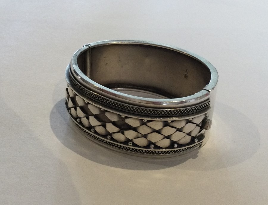 A Victorian silver hinged bangle with concealed cl