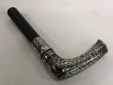 An Edwardian silver mounted walking stick handle.