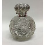 A good silver mounted hobnail cut scent bottle wit