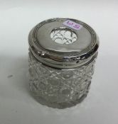 A small engine turned silver hat pin jar with glas