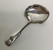 A George III fiddle pattern silver caddy spoon. Bi