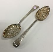 A good pair of Georgian silver berry spoons with g