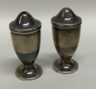 A pair of tapering silver engine turned cruets. Bi