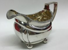 A good George III silver cream jug with gilded int