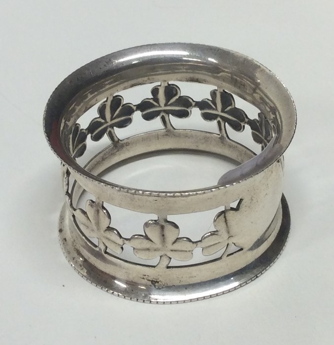 A good quality silver napkin ring decorated with c