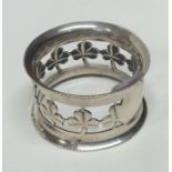 A good quality silver napkin ring decorated with c