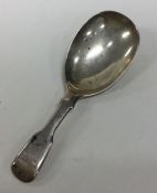 A fiddle pattern silver caddy spoon. London. By DP