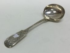 A Victorian silver fiddle pattern cream ladle. Bir