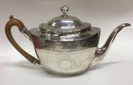 A good Georgian boat shaped silver teapot with eng